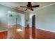 Open living space with hardwood floors and ceiling fan at 7108 N 10Th St, Tampa, FL 33604