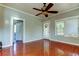 Spacious living room with hardwood floors and ceiling fan at 7108 N 10Th St, Tampa, FL 33604