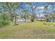 Large backyard with shed and mature trees at 7495 Mitchell Rd, Brooksville, FL 34601