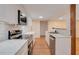 Modern kitchen with white cabinets and stainless steel appliances at 7495 Mitchell Rd, Brooksville, FL 34601