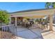 Resort-style pool area with covered grill and seating at 8796 Little Bluestem Dr, Land O Lakes, FL 34637