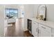 Stylish wine room with white cabinets and quartz countertops at 8796 Little Bluestem Dr, Land O Lakes, FL 34637