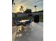 Backyard patio with a table and chairs, grill, and sunset view at 1000 Osceola Blvd, Englewood, FL 34223