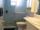 Bathroom with shower, toilet, and vanity with a white countertop at 1000 Osceola Blvd, Englewood, FL 34223