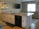 Kitchen boasts granite countertops and stainless steel appliances at 1000 Osceola Blvd, Englewood, FL 34223