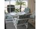 Screened porch with a patio table and four chairs, perfect for relaxing at 1000 Osceola Blvd, Englewood, FL 34223