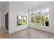 Sunlit dining room with large windows and tile floors at 1003 Signet Dr, Apollo Beach, FL 33572