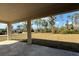 This is a shot of the back porch featuring the backyard and the houses down the street at 1504 Kohlenberg Ave, North Port, FL 34288