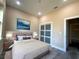 This is a modern bedroom featuring recessed lights and a closet with sliding panel doors at 1504 Kohlenberg Ave, North Port, FL 34288