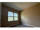 An empty bedroom featuring neutral paint, recessed lights, and a bright window at 1504 Kohlenberg Ave, North Port, FL 34288