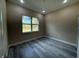 Bedroom featuring a large window, recessed lighting, and modern wood-look flooring at 1504 Kohlenberg Ave, North Port, FL 34288