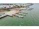 Aerial view of a boat ramp with several docks and parking area at 718 New York St, Clearwater, FL 33756