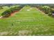 Aerial view of a golf driving range with golfers practicing their swings at 718 New York St, Clearwater, FL 33756