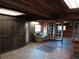 Cozy living room with wood paneled walls and ceiling, natural light, and comfortable seating at 718 New York St, Clearwater, FL 33756