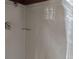 Simple shower stall with white tile and glass door at 718 New York St, Clearwater, FL 33756