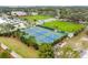 Aerial view of well-maintained tennis courts in a residential community at 718 New York St, Clearwater, FL 33756