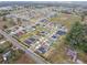 Aerial view of a large residential community with many houses at 9474 Sanders Park Pl, Seffner, FL 33584