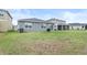 House with backyard and grassy lawn at 9474 Sanders Park Pl, Seffner, FL 33584