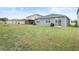 Large backyard with grassy area at 9474 Sanders Park Pl, Seffner, FL 33584