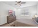 Well lit bedroom with a comfy bed and a dresser at 9474 Sanders Park Pl, Seffner, FL 33584