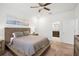 Comfortable bedroom with a platform bed and ensuite bathroom at 9474 Sanders Park Pl, Seffner, FL 33584