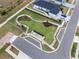 An aerial view of a neighborhood park with walking paths and benches at 9474 Sanders Park Pl, Seffner, FL 33584