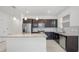 Granite countertops and stainless steel appliances highlight this modern kitchen at 9474 Sanders Park Pl, Seffner, FL 33584