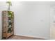 Wooden shelving unit with various potted plants at 9474 Sanders Park Pl, Seffner, FL 33584