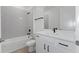 Modern bathroom with subway tile and white vanity at 1017 Signet Dr, Apollo Beach, FL 33572