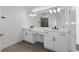 Elegant bathroom with double vanity, modern fixtures, and tile flooring at 1017 Signet Dr, Apollo Beach, FL 33572