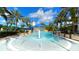 Resort-style pool with water features, a slide, and a lighthouse backdrop at 1017 Signet Dr, Apollo Beach, FL 33572