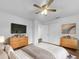 Bright bedroom with large bed, dresser, and TV at 2044 27Th W Ave, Bradenton, FL 34205