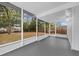 Screened porch with view of backyard and fence at 2044 27Th W Ave, Bradenton, FL 34205