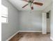 Simple bedroom with ceiling fan, carpet, and a closet at 4212 Empire Pl, Tampa, FL 33610