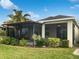 Screened patio with lush landscaping at 706 Fern Leaf Dr, Ruskin, FL 33570