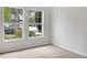 Bright bedroom with carpeted floor and large windows at 706 Fern Leaf Dr, Ruskin, FL 33570