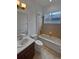 Clean bathroom with tub, shower, and updated vanity at 8955 Garden Party Dr, Land O Lakes, FL 34637