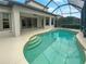 Relaxing pool area with screened enclosure at 8955 Garden Party Dr, Land O Lakes, FL 34637