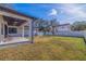 Large backyard with grassy area and white fence at 988 47Th N Ave, St Petersburg, FL 33703