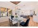 Elegant dining room with glass top table and modern chandelier, open to kitchen at 988 47Th N Ave, St Petersburg, FL 33703