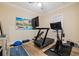 Bright home gym with treadmill, stationary bike, and weights at 988 47Th N Ave, St Petersburg, FL 33703