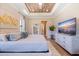 Luxurious main bedroom with large bed, stylish decor and ensuite bathroom access at 988 47Th N Ave, St Petersburg, FL 33703