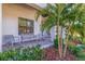 Relaxing front porch with rocking chairs and lush landscaping at 988 47Th N Ave, St Petersburg, FL 33703