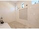 Large walk-in shower with marble tile and multiple shower heads at 988 47Th N Ave, St Petersburg, FL 33703