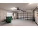 Spacious garage with ample storage, shelving, and overhead lighting at 1147 Yachtsman Ln, Punta Gorda, FL 33983