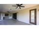 Covered patio with an outdoor bar, ceiling fans, and access door at 1147 Yachtsman Ln, Punta Gorda, FL 33983