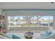 Sunroom with water views and comfortable seating at 1648 La Gorce Dr, Venice, FL 34293