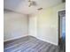 Spacious bedroom with wood-look floors and double door closet at 12600 Jillian Cir, Hudson, FL 34669