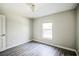 Bright bedroom with wood-look floors and a large window at 12600 Jillian Cir, Hudson, FL 34669