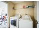 Laundry room with washer, dryer, and shelving at 12600 Jillian Cir, Hudson, FL 34669